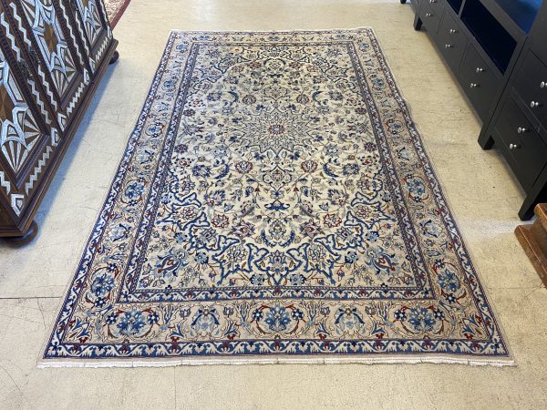 8’10” x 5’5″ Floral Naiin Wool Area Rug